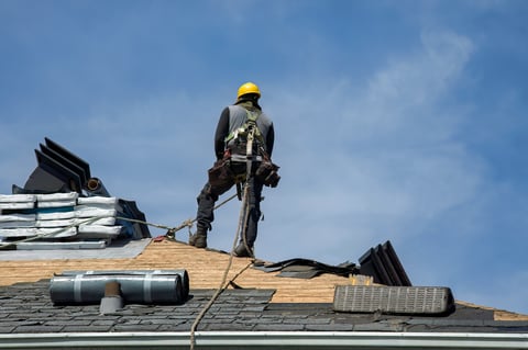 Worker on roof structure